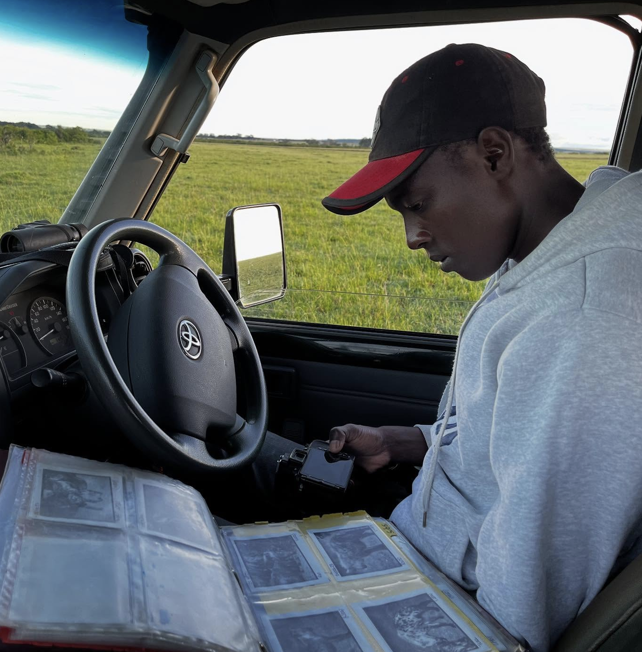 Research assistant conducting hyena fieldwork in the Maasai Mara.