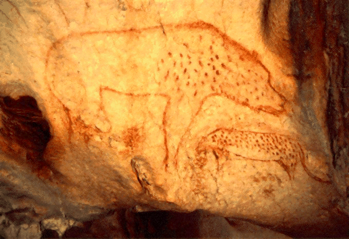 A crudely drawn hyena in red paint on a cave wall.