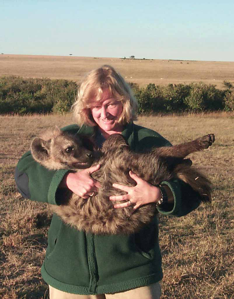 Kay Holekamp with hyena cub