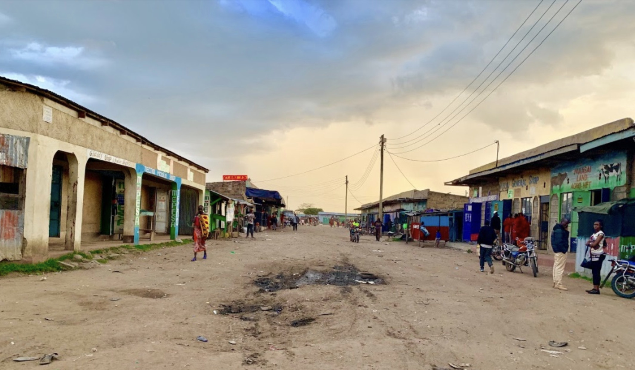 Shops line the muddy street of Talek town